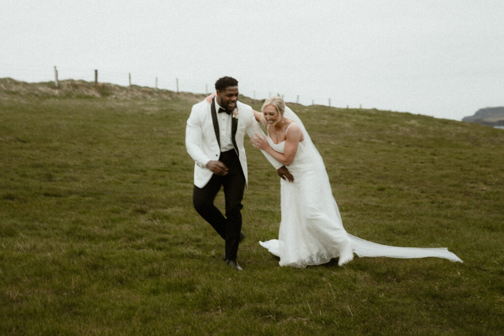 couple having a laugh as they walk along the irish green countryside